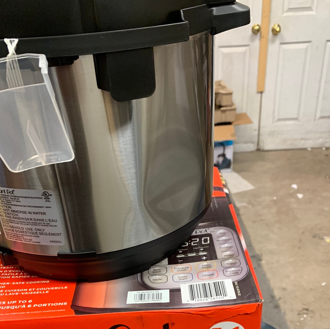 Instant Pot® Duo™ 6qt electric pressure cooker, dent on side not effecting performance