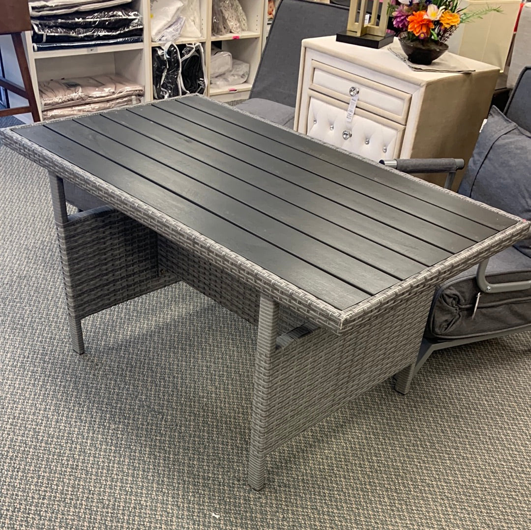 52`` x 30`` grey wash rattan frame patio table with black slat top, minor scratch, fully awssembled